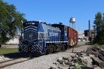 Passing the switch, 1501 shoves boxcars up to the loading bay